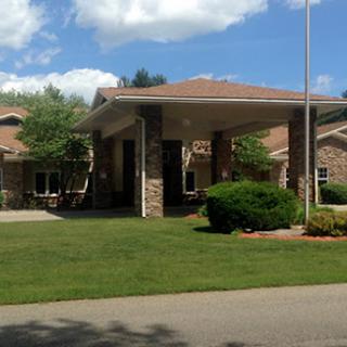A charming single-story house with a well-maintained front yard and inviting entryway.