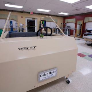A specialized therapy vehicle designed for rehabilitation purposes in a medical setting.