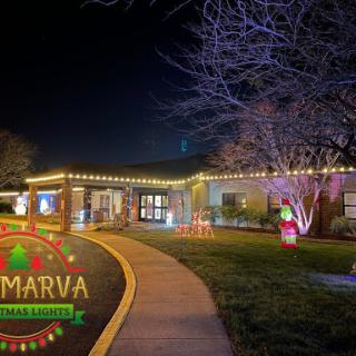 A beautifully decorated building illuminated with festive lights during the holiday season.