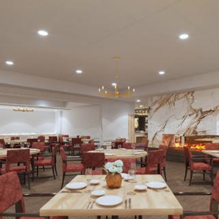 An elegant and spacious dining area featuring contemporary decor and comfortable seating.