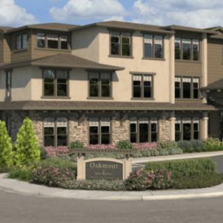A modern residential building with well-maintained landscaping.