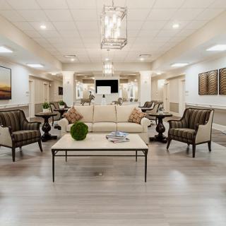 A modern living room with elegant furniture and decor.