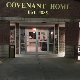 The entrance of Covenant Home, established in 1885, illuminated at night.