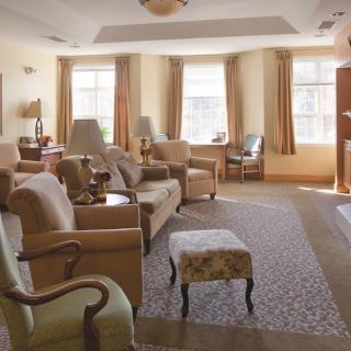 A cozy living room with comfortable seating and natural lighting.