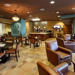 A hotel lobby featuring comfortable seating and a stylish reception area.