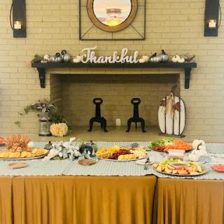 A beautifully arranged Thanksgiving feast featuring a variety of dishes and festive decor.