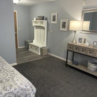 A modern, comfortable bedroom with stylish furniture and neutral tones.