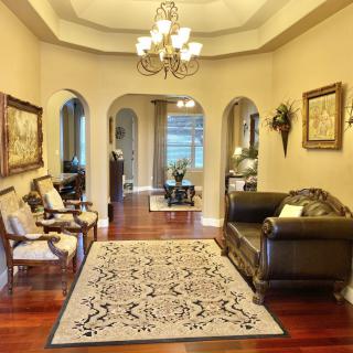 Elegant living room with classic furniture and a chandelier.