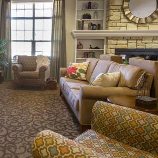 A cozy living room with comfortable seating and elegant decor.