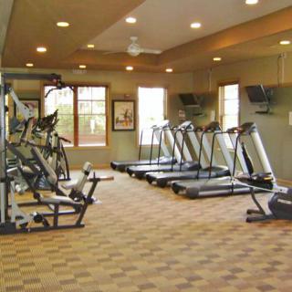 A well-equipped gym with treadmills and stationary bikes.