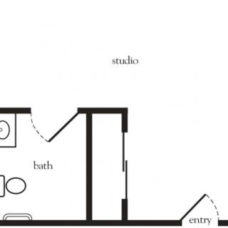 A floor plan of a studio apartment featuring an entryway, bathroom, and main living area.