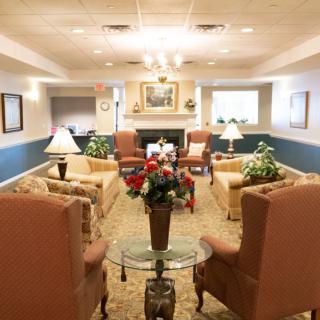 A cozy living room with comfortable seating and elegant decor.