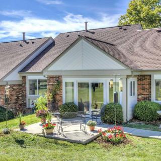 A suburban house with a well-maintained patio and garden area.