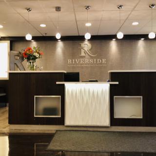 A sleek and modern reception area with elegant lighting and a welcoming ambiance.