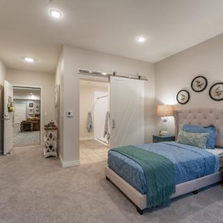 A modern bedroom with stylish decor and a comfortable bed.