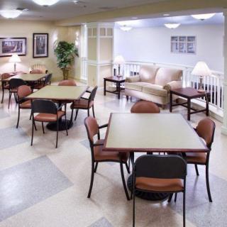 A cozy indoor seating area with tables and chairs, ideal for social gatherings.