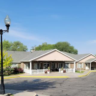 A welcoming residential community under a clear blue sky.