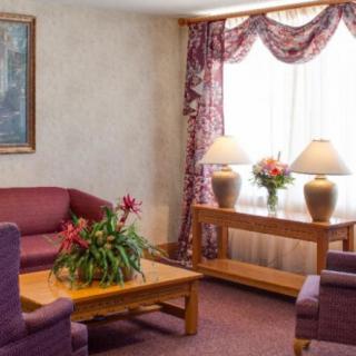 A cozy living room with plush seating and warm lighting.