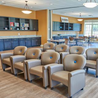 A spacious waiting room with comfortable seating and modern decor.