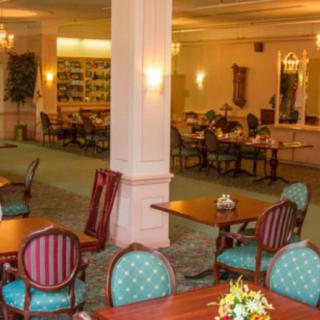 A well-appointed dining area with elegant furniture and soft lighting.