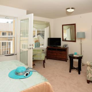 A cozy and well-decorated bedroom with a fresh, bright atmosphere.