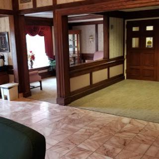 A cozy lobby area featuring wooden accents and a warm atmosphere.