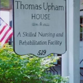 Sign for Thomas Upham House, a skilled nursing and rehabilitation facility.