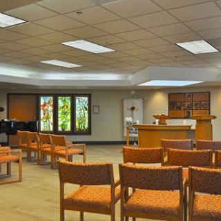 A serene waiting room featuring comfortable seating and ample natural light.