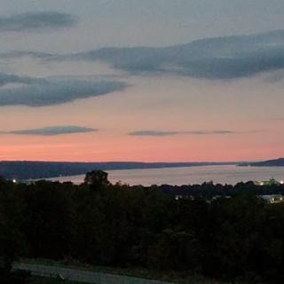 A serene sunset over the water, highlighting the beauty of nature.