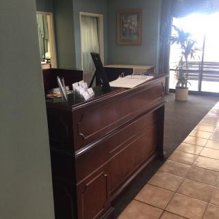 A reception desk in an office lobby area.