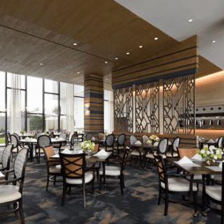 A modern and elegantly designed restaurant interior with neatly arranged tables and chairs.