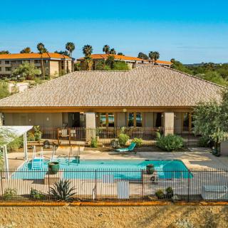 A beautiful vacation home with a swimming pool and garden.