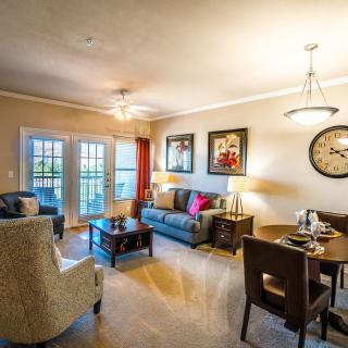A cozy living room with stylish furniture and warm lighting.