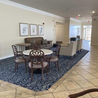 A spacious living and dining area with elegant furniture and decor.