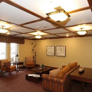 A cozy living room with comfortable seating and warm lighting.