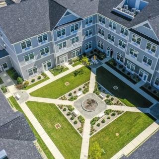 Aerial view of a landscaped courtyard within a residential apartment complex.