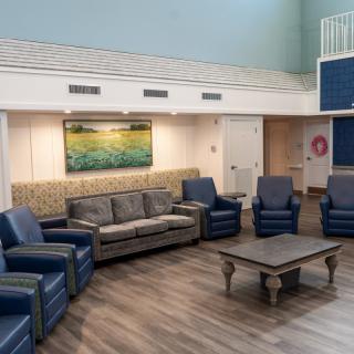 A modern and cozy living room with comfortable seating and a central table.