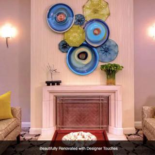 Stylish living room interior with colorful wall art and elegant decor.