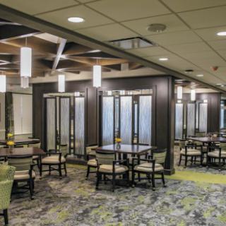 A modern restaurant seating area with stylish lighting and decor.