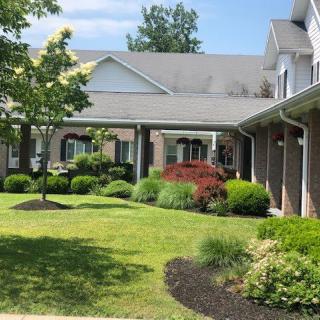 A well-maintained residential building with lush landscaping and greenery.