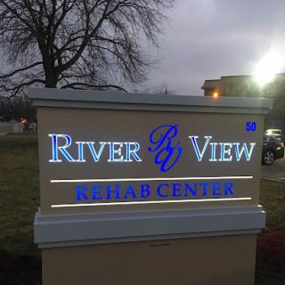 Sign for River View Rehab Center, indicating location and services.