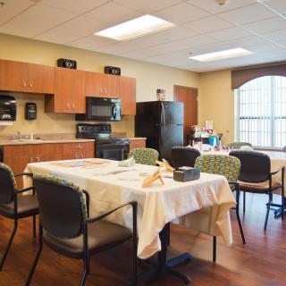 A cozy kitchen and dining area with a table set for a meal.