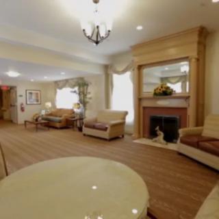 A cozy living room with elegant furniture and a fireplace.