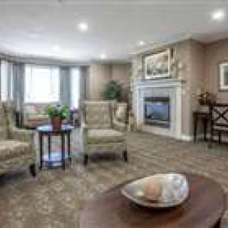 A cozy living room with comfortable seating, a fireplace, and stylish decor.
