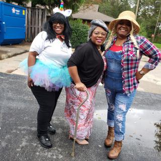 A group of friends enjoying a festive day in their creative costumes.
