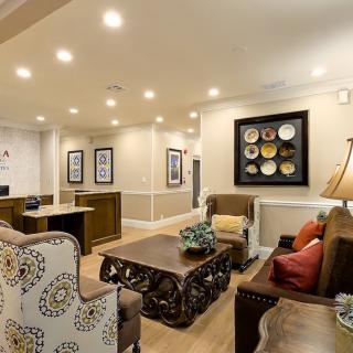 A cozy living room with elegant furnishings and stylish artwork.