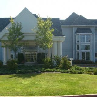 A suburban house with well-maintained landscaping.