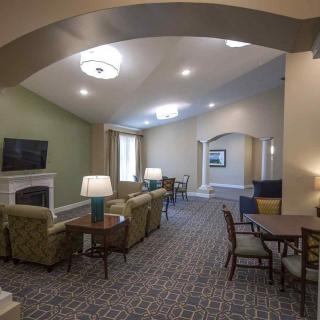 Spacious lounge area with comfortable seating and modern decor.