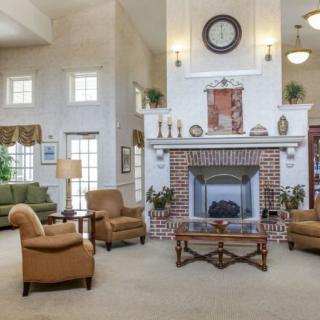 Spacious living room with a cozy fireplace and comfortable seating arrangement.