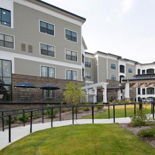 A modern residential apartment complex featuring landscaped grounds and a welcoming environment.